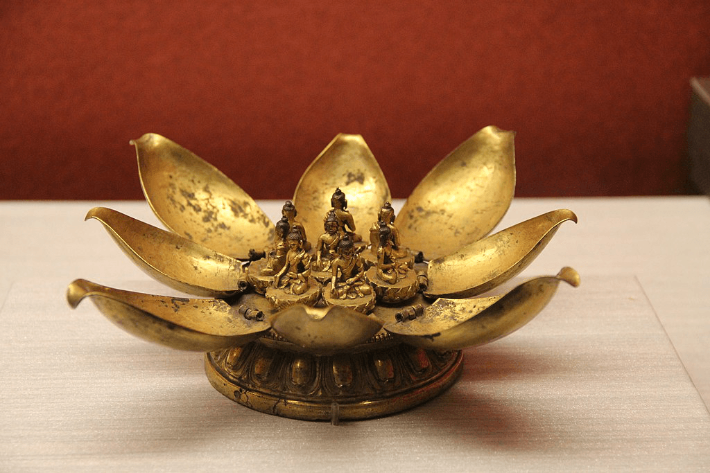 Gilded bronze lotus mandala sculpture from Tibet with five seated Buddha figures on open lotus petals